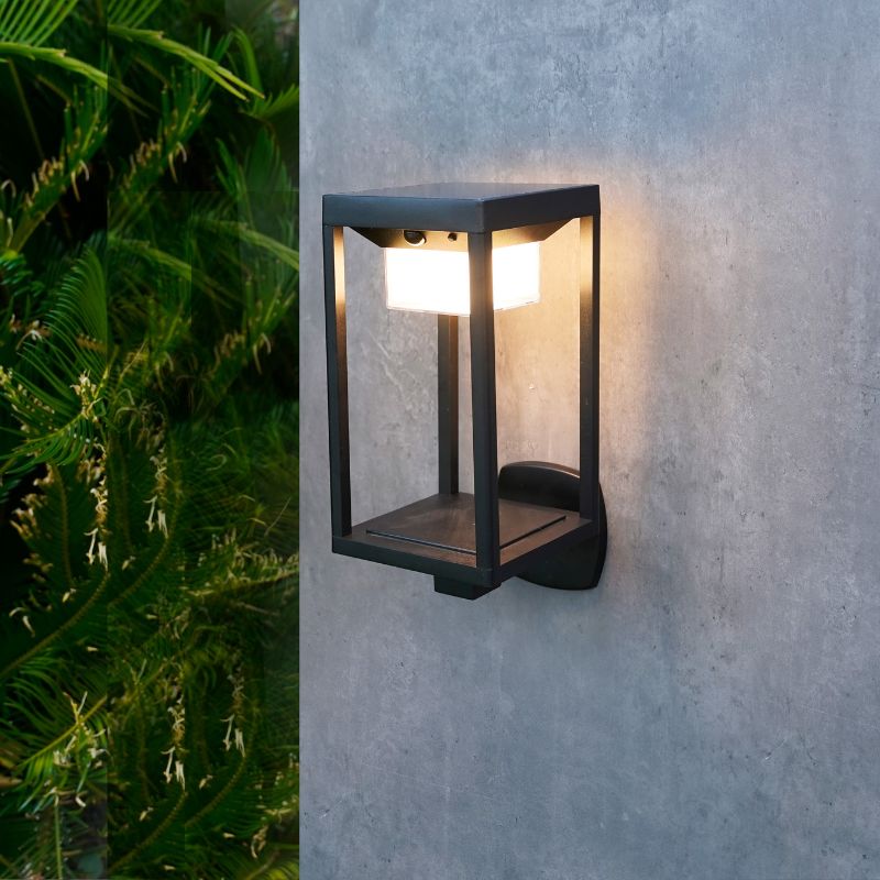 Ningbo Hanyuan smart Tuya wall lamp lantern design, black outdoor light mounted on the wall, surrounded by greenery.