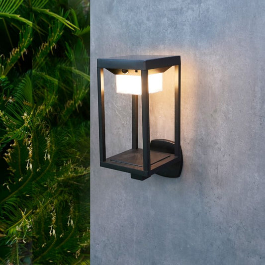 Ningbo Hanyuan smart Tuya wall lamp lantern design, black outdoor light mounted on the wall, surrounded by greenery.